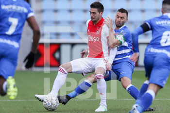 2021-03-14 - Dusan Tadic of Ajax, Bram van Polen of PEC Zwolle during the Netherlands championship Eredivisie football match between PEC Zwolle and Ajax on March 14, 2021 at MAC3PARK stadion in Zwolle, Netherlands - Photo Marcel ter Bals / Orange Pictures / DPPI - PEC ZWOLLE AND AJAX - NETHERLANDS EREDIVISIE - SOCCER