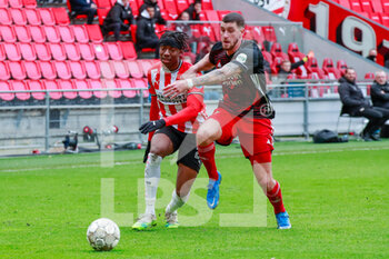 2021-03-14 - Noni Madueke of PSV Eindhoven and Marcos Senesi of Feyenoord during the Netherlands championship Eredivisie football match between PSV and Feyenoord on March 14, 2021 at Philips Stadion in Eindhoven, Netherlands - Photo Broer van den Boom / Orange Pictures / DPPI - PSV AND FEYENOORD - NETHERLANDS EREDIVISIE - SOCCER