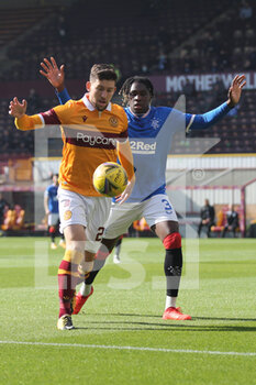 2020-09-27 - Callum Lang (Motherwell) is challenged by Calvin Bassey (Rangers) during the Scottish championship, Premiership football match between Motherwell and Rangers on September 27, 2020 at Fir Park in Motherwell, Scotland - Photo Chris McCluskie / ProSportsImages / DPPI - MOTHERWELL VS RANGERS - SCOTTISH PREMIERSHIP - SOCCER