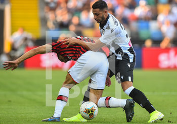 2019-08-25 - Ricardo Rodriguez del Milan contrastato da Rolando Mandragora dell’Udinese. - UDINESE VS MILAN - ITALIAN SERIE A - SOCCER