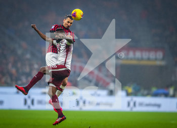 2020-02-17 - Zlatan Ibrahimovic of AC Milan fights for the ball against Nicolas Nkoulou of Torino FC during the Serie A 2019/20 match between AC Milan vs Torino FC at the San Siro Stadium, Milan, Italy on February 17, 2020 - Photo Fabrizio Carabelli - MILAN VS TORINO - ITALIAN SERIE A - SOCCER