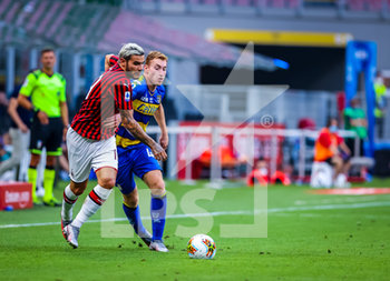 2020-07-15 - Dejan Kulusevski of Parma Calcio fights for the ball against Theo Hernandez of AC Milan during the Serie A 2019/20 match between AC Milan vs Parma Calcio at the San Siro Stadium, Milan, Italy on July 15, 2020 - Photo Fabrizio Carabelli - MILAN VS PARMA - ITALIAN SERIE A - SOCCER