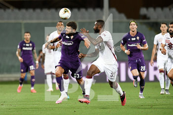 2020-07-19 - Patrick Cutrone of ACF Fiorentina in action against Nicolas Nkoulou of Torino FC  - FIORENTINA VS TORINO - ITALIAN SERIE A - SOCCER