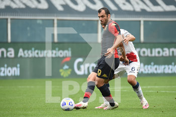 2020-09-20 - Goran Pandev (Genoa), Lisandro Magallán (Crotone) in action during the match Serie A TIM between CFC Genoa and FC Crotone on September 20,2020 in Genoa (Italy) at Marassi Stadium - GENOA VS CROTONE - ITALIAN SERIE A - SOCCER