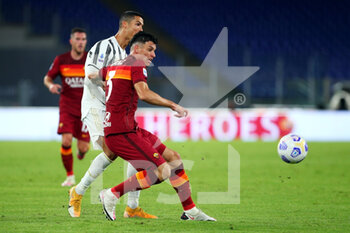 2020-09-27 - Cristiano Ronaldo of Juventus (L) and Roger Ibanez of Roma (R) in action during the Italian championship Serie A football match between AS Roma and Juventus FC on September 27, 2020 at Stadio Olimpico in Rome, Italy - Photo Federico Proietti / DPPI - AS ROMA VS JUVENTUS FC - ITALIAN SERIE A - SOCCER