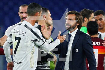 2020-09-27 - Juventus head coach Andrea Pirlo (R) and Cristiano Ronaldo (L) of Juventus greet each other at the end of the Italian championship Serie A football match between AS Roma and Juventus FC on September 27, 2020 at Stadio Olimpico in Rome, Italy - Photo Federico Proietti / DPPI - AS ROMA VS JUVENTUS FC - ITALIAN SERIE A - SOCCER
