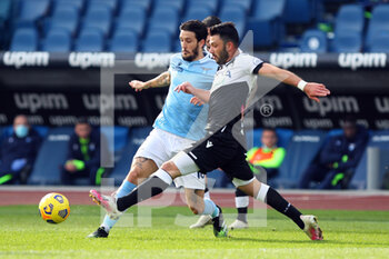 2020-11-29 - Luis Alberto of Lazio (L) vies for the ball with Tolgay Arslan (R) during the Italian championship Serie A football match between SS Lazio and Udinese Calcio on November 29, 2020 at Stadio Olimpico in Rome, Italy - Photo Federico Proietti / DPPI - SS LAZIO VS UDINESE CALCIO - ITALIAN SERIE A - SOCCER