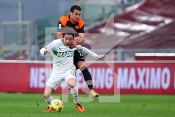 2020-12-06 - Maxime Lopez of Sassuolo goes down after a challange by Pedro Rodriguez of Roma (UP) during the Italian championship Serie A football match between AS Roma and US Sassuolo Calcio on December 6, 2020 at Stadio Olimpico in Rome, Italy - Photo Federico Proietti / DPPI - AS ROMA VS US SASSUOLO CALCIO - ITALIAN SERIE A - SOCCER