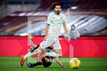 2020-12-06 - Gian Marco Ferrari of Sassuolo goes down after a challange by Henrikh Mkhitaryan of Roma during the Italian championship Serie A football match between AS Roma and US Sassuolo Calcio on December 6, 2020 at Stadio Olimpico in Rome, Italy - Photo Federico Proietti / DPPI - AS ROMA VS US SASSUOLO CALCIO - ITALIAN SERIE A - SOCCER