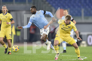 2020-12-12 - ROME, ITALY - December 12 : Akpa Akpro (L) of SS Lazio in action against Matteo Lovato R) of Hellas Verona during the Serie A soccer match between SS Lazio and Hellas Verona Stadio Olimpico on December 12,2020 in Rome, Italy  - SS LAZIO VS HELLAS VERONA - ITALIAN SERIE A - SOCCER