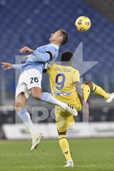 2020-12-12 - ROME, ITALY - December 12 : Stefan Radu (L) of SS Lazio in action against Eddy Salcedo Mora R) of Hellas Verona during the Serie A soccer match between SS Lazio and Hellas Verona Stadio Olimpico on December 12,2020 in Rome, Italy - SS LAZIO VS HELLAS VERONA - ITALIAN SERIE A - SOCCER