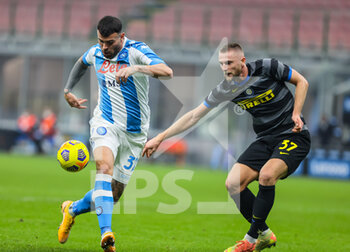 2020-12-16 - Andrea Petagna of SSC Napoli fights for the ball against Milan Skriniar of FC Internazionale during the Serie A 2020/21 football match between FC Internazionale vs SSC Napoli at the San Siro Stadium, Milan, Italy on December 16, 2020 - Photo FCI / Fabrizio Carabelli - INTER VS NAPOLI - ITALIAN SERIE A - SOCCER