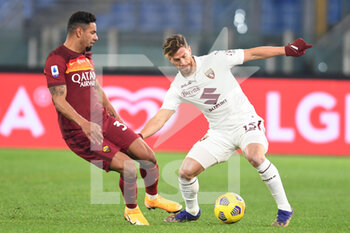 2020-12-17 - ROME, ITALY - December 17 : Bruno Perez (L) of AS Roma in action against Cristian Amsaldi (R) of Torino FC during the Serie A soccer match between AS Roma and Torino FC at Stadio Olimpico on December 17,2020 in Rome Italy - ROMA VS TORINO - ITALIAN SERIE A - SOCCER