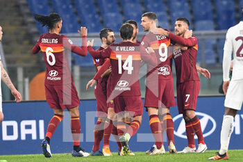 2020-12-17 -  ROME, ITALY - December 17 : Edin Dzeko (9 ) of AS Roma celebrates with his team mates after scoring a goal during Italian Serie A soccer match between AS Roma and Torino FC at Stadio Olimpico on December 17,2020 in Rome Italy - ROMA VS TORINO - ITALIAN SERIE A - SOCCER
