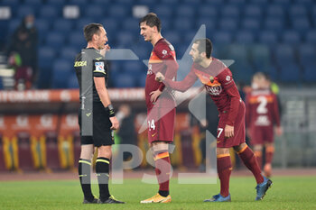 2020-12-17 - ROME, ITALY - December 17 : The Referee Roberto Abisso, Marssh Kumbulla and Henrikh Mkhitaryan greet each other at the end of Italian Serie A soccer match at between AS Roma and Torino FC Stadio Olimpico on December 17,2020 in Rome Italy  - ROMA VS TORINO - ITALIAN SERIE A - SOCCER