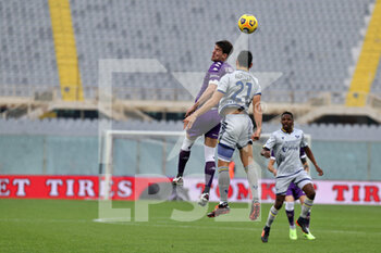 2020-12-19 - Dusan Vlahovic (ACF Fiorentina) and Koray Gunter (Hellas Verona) during the Serie A soccer match between AFC Fiorentina - Hellas Verona, Stadio Artemio Franchi on December 19, 2020 in Florence Italy - FIORENTINA VS HELLAS VERONA - ITALIAN SERIE A - SOCCER
