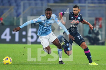 2020-12-20 - Jean Daniel Akpa Akpro of Lazio (L) vies for the ball with Faouzi Ghoulam of Napoli (R) during the Italian championship Serie A football match between SS Lazio and SSC Napoli on December 20, 2020 at Stadio Olimpico in Rome, Italy - Photo Federico Proietti / DPPI - SS LAZIO VS SSC NAPOLI - ITALIAN SERIE A - SOCCER