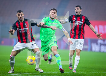 2020-12-23 - Rade Krunic of AC Milan fights for the ball against Ciro Immobile of SS Lazio during the Serie A 2020/21 football match between AC Milan vs SS Lazio at the San Siro Stadium, Milan, Italy on December 23, 2020 - Photo FCI / Fabrizio Carabelli - AC MILAN VS SS LAZIO  - ITALIAN SERIE A - SOCCER