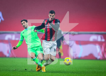 2020-12-23 - Theo Hernandez of AC Milan fights for the ball against Danilo Cataldi of SS Lazio during the Serie A 2020/21 football match between AC Milan vs SS Lazio at the San Siro Stadium, Milan, Italy on December 23, 2020 - Photo FCI / Fabrizio Carabelli - AC MILAN VS SS LAZIO  - ITALIAN SERIE A - SOCCER