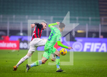 2020-12-23 - Ante Rebic of AC Milanfights for the ball against Luiz Felipe of SS Lazio during the Serie A 2020/21 football match between AC Milan vs SS Lazio at the San Siro Stadium, Milan, Italy on December 23, 2020 - Photo FCI / Fabrizio Carabelli - AC MILAN VS SS LAZIO  - ITALIAN SERIE A - SOCCER