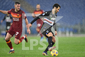 2021-01-03 - ROME, ITALY - January 3 : Fabio Quagliarella (R) of UC Sampdoria in action against Jordan Veretout (L) of AS Roma during the Serie A soccer match between AS Roma and UC Sampdoria at Stadio Olimpico on January 3,2021 in Rome Italy - ROMA VS SAMPDORIA - ITALIAN SERIE A - SOCCER