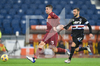 2021-01-03 - ROME, ITALY - January 3 : Gialluca Mancini (L) of AS Roma in action against Fabio Quagliarella (R) of UC Sampdoria during the Serie A soccer match between AS Roma and UC Sampdoria at Stadio Olimpico on January 3,2021 in Rome Italy - ROMA VS SAMPDORIA - ITALIAN SERIE A - SOCCER
