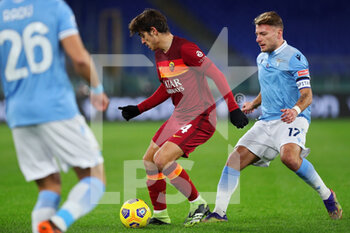 2021-01-15 - Gonzalo Villar of Roma (L) vies for the ball with Ciro Immobile of Lazio during the Italian championship Serie A football match between SS Lazio and AS Roma on January 15, 2021 at Stadio Olimpico in Rome, Italy - Photo Federico Proietti / DPPI - SS LAZIO VS AS ROMA - ITALIAN SERIE A - SOCCER
