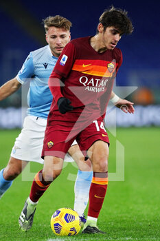 2021-01-15 - Gonzalo Villar of Roma (R) vies for the ball with Ciro Immobile of Lazio during the Italian championship Serie A football match between SS Lazio and AS Roma on January 15, 2021 at Stadio Olimpico in Rome, Italy - Photo Federico Proietti / DPPI - SS LAZIO VS AS ROMA - ITALIAN SERIE A - SOCCER
