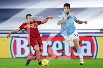 2021-01-15 - Francesco Acerbi of Lazio (R) and Henrikh Mkhitaryan of Roma in action during the Italian championship Serie A football match between SS Lazio and AS Roma on January 15, 2021 at Stadio Olimpico in Rome, Italy - Photo Federico Proietti / DPPI - SS LAZIO VS AS ROMA - ITALIAN SERIE A - SOCCER
