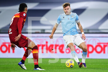 2021-01-15 - Ciro Immobile of Lazio (R) vies for the ball with Chris Smalling of Roma during the Italian championship Serie A football match between SS Lazio and AS Roma on January 15, 2021 at Stadio Olimpico in Rome, Italy - Photo Federico Proietti / DPPI - SS LAZIO VS AS ROMA - ITALIAN SERIE A - SOCCER