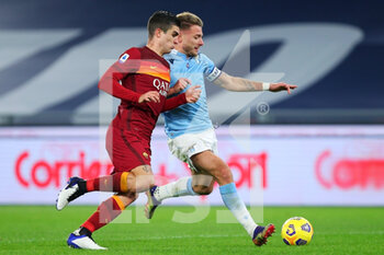 2021-01-15 - Ciro Immobile of Lazio (R) in action with Gianluca Mancini of Roma during the Italian championship Serie A football match between SS Lazio and AS Roma on January 15, 2021 at Stadio Olimpico in Rome, Italy - Photo Federico Proietti / DPPI - SS LAZIO VS AS ROMA - ITALIAN SERIE A - SOCCER