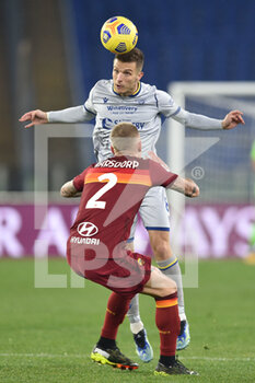 2021-01-31 - ROME, ITALY - January 31 : Darko Lazovic  (H) of Hellas Verona in action against Rick Karsdorp (R) of AS Roma during the Serie A soccer match between AS Roma and Hellas Verona at Stadio Olimpico on January 31,2021 in Rome Italy - AS ROMA VS HELLAS VERONA - ITALIAN SERIE A - SOCCER