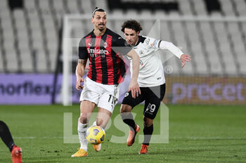 2021-02-13 - Zlatan Ibrahimovic of AC Milan in action against Luca Vignali of AC Spezia - SPEZIA CALCIO VS AC MILAN - ITALIAN SERIE A - SOCCER