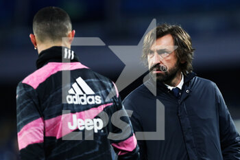 2021-02-13 - Andrea Pirlo head coach of Juventus (R) and Cristiano Ronaldo (L) talk each other during warm up before the Italian championship Serie A football match between SSC Napoli and Juventus FC on February 13, 2021 at Diego Armando Maradona Stadium in Naples, Italy - Photo Federico Proietti / DPPI - SSC NAPOLI AND JUVENTUS FC - ITALIAN SERIE A - SOCCER