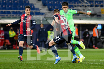 2021-02-27 - Carlos Joaquin Correa (Lazio) carries the ball hindered by Mattias Svanberg (Bologna) - BOLOGNA FC VS SS LAZIO - ITALIAN SERIE A - SOCCER