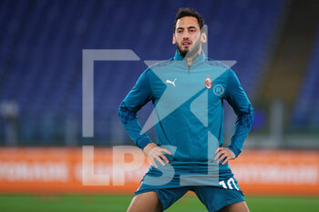 2021-02-28 - Hakan Calhanoglu of Milan warming up before the Italian championship Serie A football match between AS Roma and AC Milan on February 28, 2021 at Stadio Olimpico in Rome, Italy - Photo Federico Proietti / DPPI - AS ROMA AND AC MILAN - ITALIAN SERIE A - SOCCER