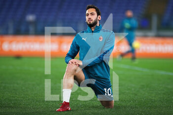 2021-02-28 - Hakan Calhanoglu of Milan warming up before the Italian championship Serie A football match between AS Roma and AC Milan on February 28, 2021 at Stadio Olimpico in Rome, Italy - Photo Federico Proietti / DPPI - AS ROMA AND AC MILAN - ITALIAN SERIE A - SOCCER