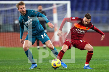 2021-02-28 - Simon Kjaer of Milan (L) vies for the ball with Borja Mayoral of Roma (R) during the Italian championship Serie A football match between AS Roma and AC Milan on February 28, 2021 at Stadio Olimpico in Rome, Italy - Photo Federico Proietti / DPPI - AS ROMA AND AC MILAN - ITALIAN SERIE A - SOCCER