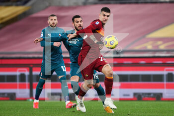 2021-02-28 - Gianluca Mancini of Roma (R) fights for the ball with Theo Hernandez of Milan (L) during the Italian championship Serie A football match between AS Roma and AC Milan on February 28, 2021 at Stadio Olimpico in Rome, Italy - Photo Federico Proietti / DPPI - AS ROMA AND AC MILAN - ITALIAN SERIE A - SOCCER
