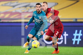 2021-02-28 - Theo Hernandez of Milan (L) vies for the ball with Rick Karsdorp of Roma (R) during the Italian championship Serie A football match between AS Roma and AC Milan on February 28, 2021 at Stadio Olimpico in Rome, Italy - Photo Federico Proietti / DPPI - AS ROMA AND AC MILAN - ITALIAN SERIE A - SOCCER