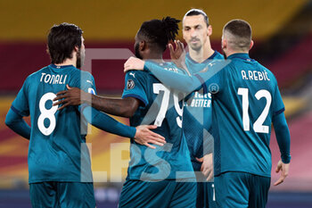 2021-02-28 - Franck Kessie of Milan celebrates with his teammates after scoring 0-1 goal by penalty during the Italian championship Serie A football match between AS Roma and AC Milan on February 28, 2021 at Stadio Olimpico in Rome, Italy - Photo Federico Proietti / DPPI - AS ROMA AND AC MILAN - ITALIAN SERIE A - SOCCER