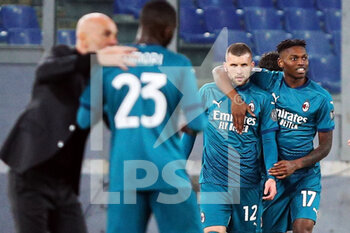 2021-02-28 - Ante Rebic of Milan (3L) celebrates with Rafael Leao (4L) after scoring 1-2 goal during the Italian championship Serie A football match between AS Roma and AC Milan on February 28, 2021 at Stadio Olimpico in Rome, Italy - Photo Federico Proietti / DPPI - AS ROMA AND AC MILAN - ITALIAN SERIE A - SOCCER