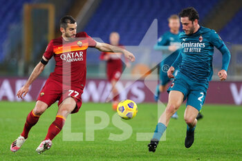 2021-02-28 - Davide Calabria of Milan (R) vies for the ball with Henrikh Mkhitaryan of Roma (L) during the Italian championship Serie A football match between AS Roma and AC Milan on February 28, 2021 at Stadio Olimpico in Rome, Italy - Photo Federico Proietti / DPPI - AS ROMA AND AC MILAN - ITALIAN SERIE A - SOCCER