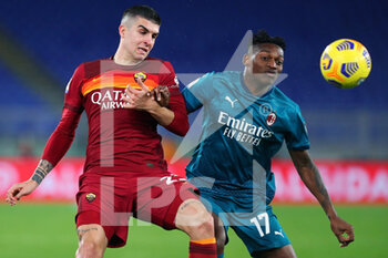 2021-02-28 - Gianluca Mancini of Roma (L) vies for the ball with Rafael Leao of Milan (R) during the Italian championship Serie A football match between AS Roma and AC Milan on February 28, 2021 at Stadio Olimpico in Rome, Italy - Photo Federico Proietti / DPPI - AS ROMA AND AC MILAN - ITALIAN SERIE A - SOCCER