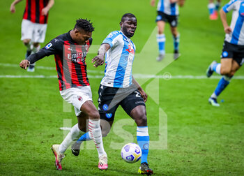 2021-03-14 - Rafael Leao of AC Milan fights for the ball against Kalidou Koulibaly of SSC Napoli - AC MILAN VS SSC NAPOLI - ITALIAN SERIE A - SOCCER