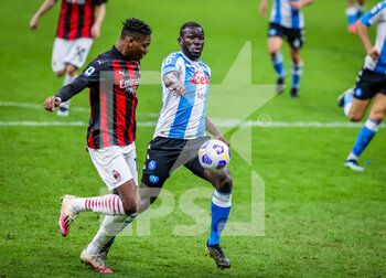 2021-03-14 - Rafael Leao of AC Milan fights for the ball against Kalidou Koulibaly of SSC Napoli - AC MILAN VS SSC NAPOLI - ITALIAN SERIE A - SOCCER