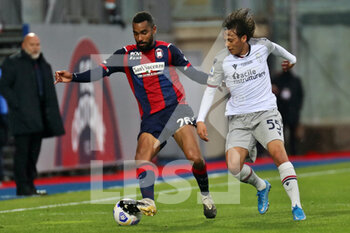 2021-03-20 - Koffi Djidji (Crotone FC) and Emanuel Vignato (Bologna FC) during the Serie A soccer match between Crotone FC - Bologna FC, Stadio Ezio Scida on March 20, 2021 in Crotone Italy - FC CROTONE VS BOLOGNA FC - ITALIAN SERIE A - SOCCER