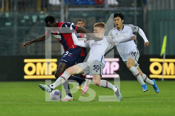 2021-03-20 - Simy (Crotone FC) and Jerdy Schouten (Bologna FC) during the Serie A soccer match between Crotone FC - Bologna FC, Stadio Ezio Scida on March 20, 2021 in Crotone Italy - FC CROTONE VS BOLOGNA FC - ITALIAN SERIE A - SOCCER