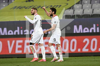 2021-03-21 - Hakan Calhanoglu of AC Milan celebrates after scoring a goal - ACF FIORENTINA VS AC MILAN - ITALIAN SERIE A - SOCCER