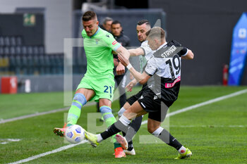 2021-03-21 - Sergej Milinkovic-Savic (Lazio) in action against Jens Stryger Larsen (Udinese) - UDINESE CALCIO VS SS LAZIO - ITALIAN SERIE A - SOCCER